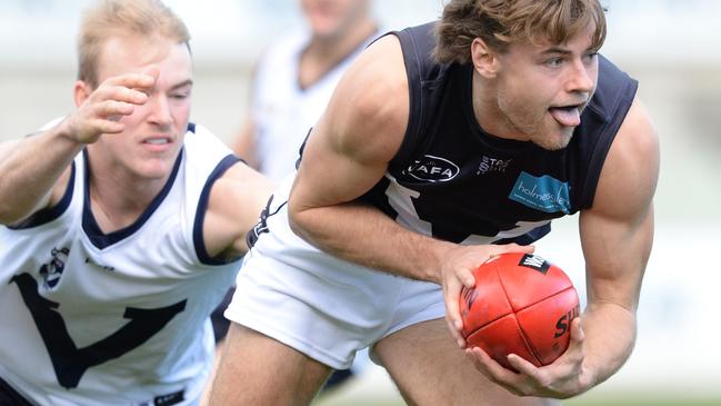 VAFA’s Connor Lappin looks to break free during Saturday’s clash with AFL Victoria Country. Picture: Chris Eastman