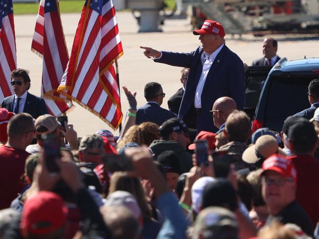 Supporters cheer as Former US President and 2024 Republican presidential candidate Donald Trump gestures during a campaign rally at the Central Wisconsin Airport in Mosinee, Wisconsin. Picture: AFP