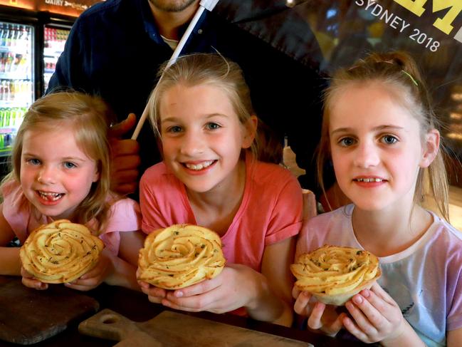 L-R Glenorie Bakery Rob Pirina poses for photographs with Sisters Indiana 5, Cameryn 9, and Sophine Gillies 8, at Glenorie Bakery in Glenorie. Glenorie, Monday, October 2nd 2018. Glenorie Bakery have created an "Invictus Pie" and is donating $5 from pie sold to raise funds for the Invictus Games. (AAP Image / Angelo Velardo)