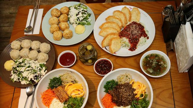 Mandoo restaurant in Adelaide serves dishes such as vegetarian bibimbap, beef bibimbap, fried and steamed pork dumplings and bi-bim-mandoo. Picture: Dylan Coker