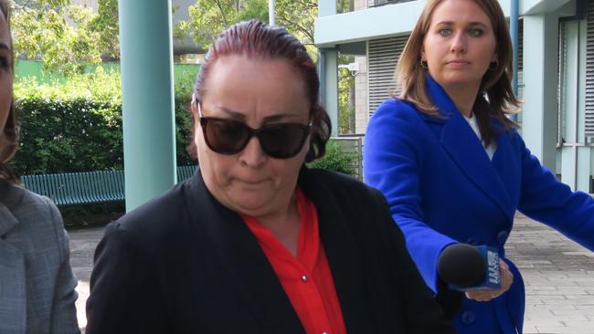 Maria Virgili (red shirt black suit) arrives at Gosford District Court for sentence. Picture: Richard Noone