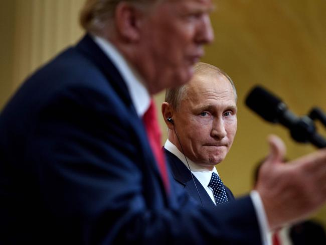 Putin listens to Trump speaks during a press conference.  Picture:  AFP