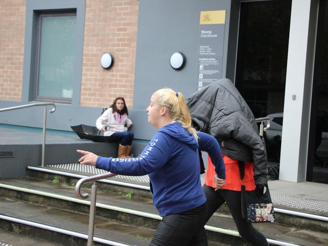 Stephanie Belthikiotis covered her face as she left Wyong Local Court following her first appearance in May.