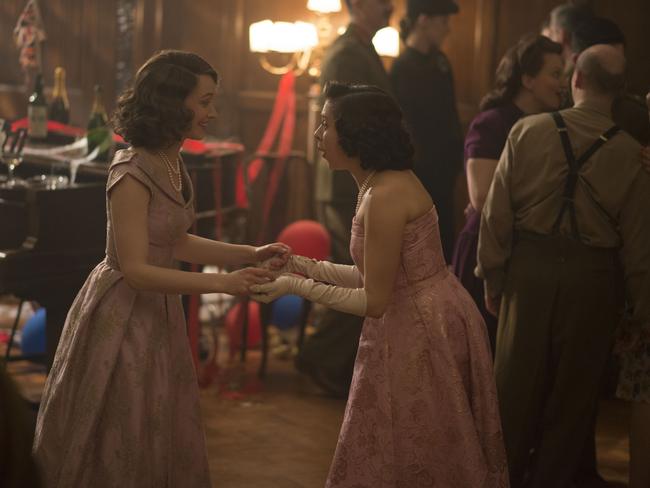 shall we dance with ourselves or with the boys ... Actor Sarah Gadon (left) plays Princess Elizabeth and Bel Powley portrays Princess Margaret in a scene from A Royal Night Out.