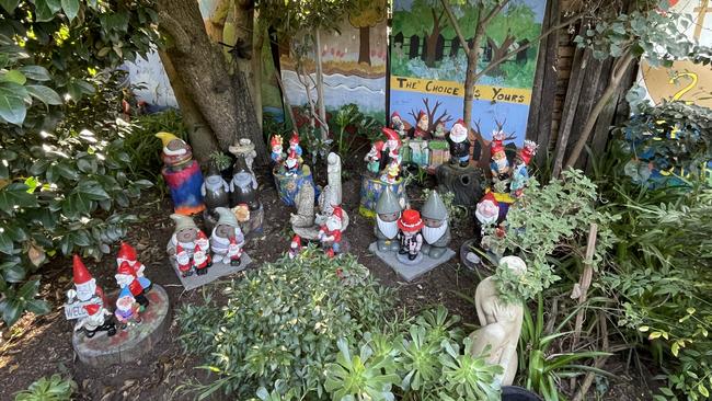 Recycles gnomes and other statues found in the tip which make up Heather Marcus' Werribee gnomesville.