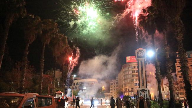 Syrians celebrate in the main square of Homs. Picture: AFP