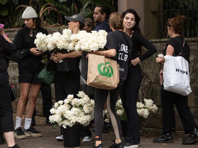 Florists with buckets of roses arrive at Swifts mansion in Darling Point, where the wedding to take place on Saturday afternoon. Picture: Julian Andrews