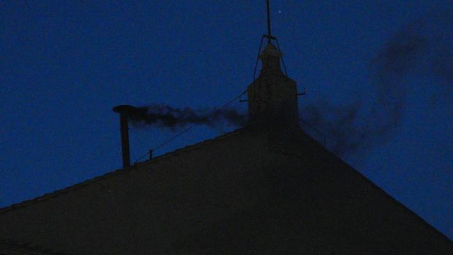 Black smoke is seen from the chimney of the Sistine Chapel meaning a new pope is not yet elected and voting will continue tomorrow. Picture: Christopher Furlong/Getty Images