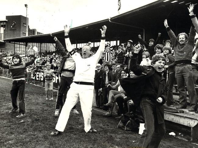 Magpie supporters and trainers go wild after a win over Geelong in 1979.