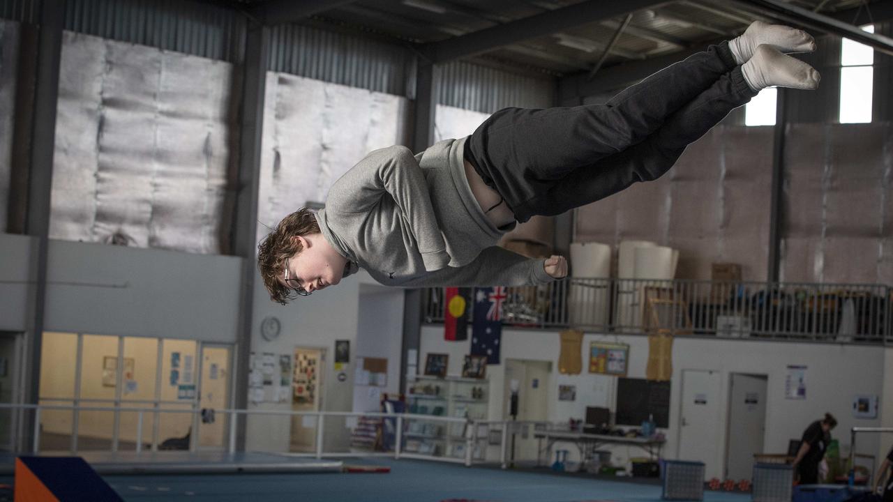 Tasmanian James Harvey, 15, now holds the world record for the greatest number of consecutive “cat twists” on a trampoline. Picture: Chris Kidd
