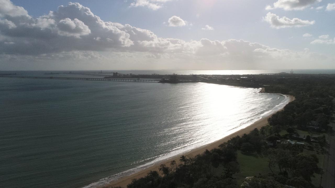 The town of Louisa Creek has a tranquil beachfront excluding the coal terminal to its right. Picture: Heidi Petith