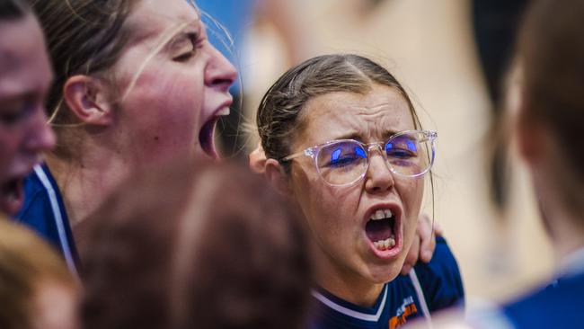 Victoria’s Ivor Burge women belt out their team song after claiming their fourth straight title.