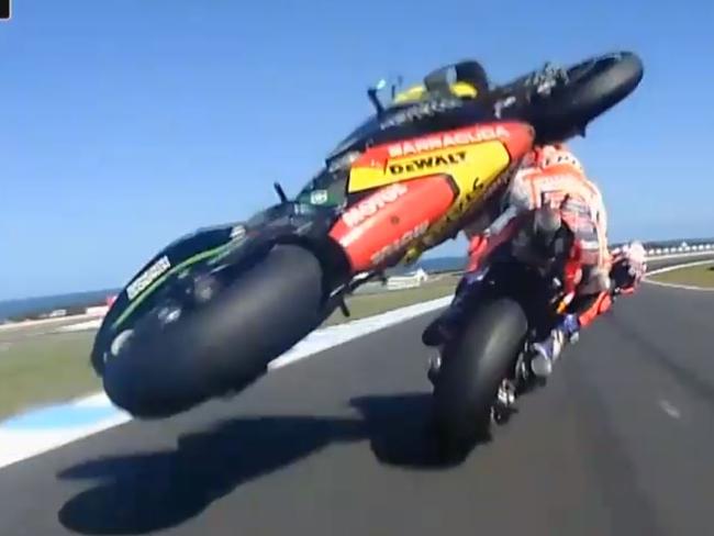 Marc Marquez has bike land on the back of his bike.