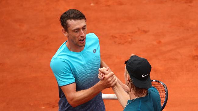 John Millman congratulates Denis Shapovalov following their mens singles first round match during day three of the 2018 French Open. (Photo by Clive Brunskill/Getty Images)