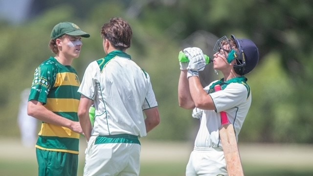 St Pats v St Edmunds batsmen have a drink.