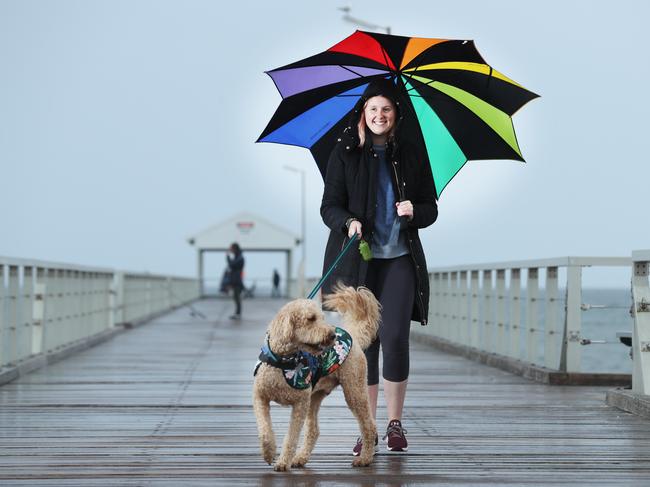 Sarah Golfis with her dog Frank at Henley Beach. Picture: Tait Schmaal