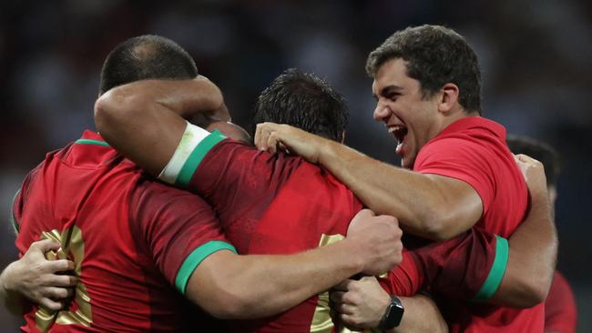 Portugal's flanker Manuel Picao (R) celebrates with teammates after victory in the France 2023 Rugby World Cup Pool C match between Fiji and Portugal at the Stade de Toulouse in Toulouse, southwestern France on October 8, 2023. (Photo by Valentine CHAPUIS / AFP)