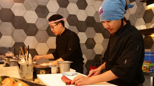 Sushi chefs, Genki, in front, and Marco at work.