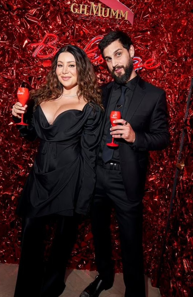 Martha Kalifatidis and Michael Brunelli at the G.H. Mumm Derby Day party. Picture: Supplied