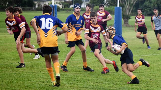 Jack Butcher, Gilroy, on his way to the try line. Photographs from the Will Murdoch Perpetual Shield. The annual U14 rugby league competition, in its second year, involved Gilroy Santa Maria College, Ingham State High School and St Teresa's Catholic College Abergowrie. Picture: Cameron Bates