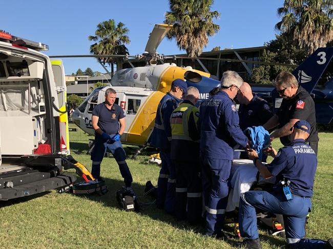 CareFlight has today responded to two back-to-back taskings for missions involving men in their 60s who have fallen three metres from roofs at their Wahroonga and Dundas Valley residences. Both men were taken to hospital with serious head injuries.CareFlight’s Rapid Response Helicopter was first tasked shortly after 10:00am and landed in a Wahroonga oval where a passing SES volunteer drove CareFlight’s aeromedical team to the scene of the incident.At the Wahroonga residence, NSW Ambulance paramedics were providing initial treatment to the 68-year-old man who had sustained serious head and chest injuries and fractured ribs.CareFlight’s specialist doctor and NSW Ambulance critical care paramedic assessed the patient’s condition and prepared him for transport to hospital.The man was taken by road ambulance in a serious condition to Royal North Shore Hospital under ongoing observation from CareFlight’s clinical team. Picture: CareFlight