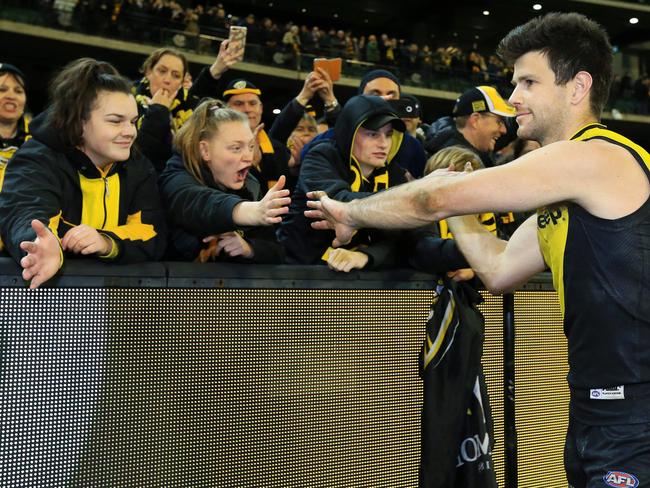 Trent Cotchin celebrates with fans after the win. Picture: Mark Stewart