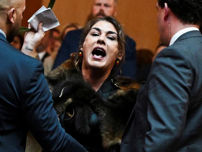 Australian Senator Lidia Thorpe stages a protest as Britain's King Charles and Queen Camilla attend a Parliamentary reception in Canberra, Australia - 21 Oct 2024. Victoria Jones/Pool via REUTERS TPX IMAGES OF THE DAY