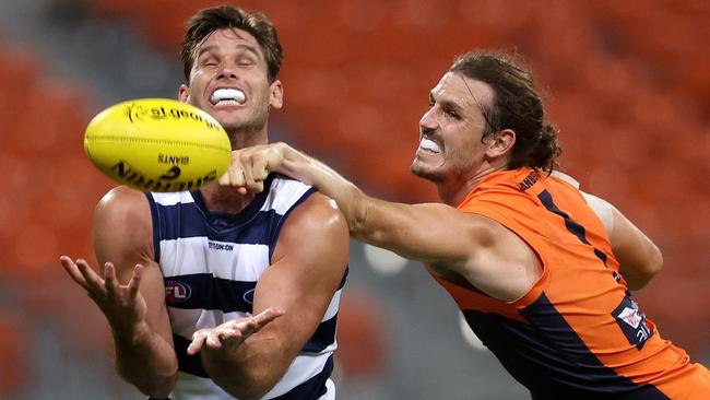 Geelong's Tom Hawkins against GWS Giants’ Phil Davis. Picture. Phil Hillyard