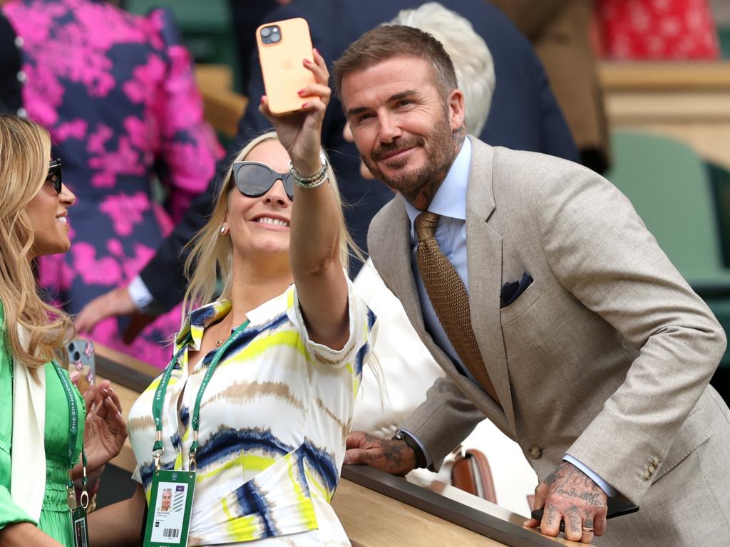 David Beckham poses for a selfie with a fan from the Royal Box following the Gentlemen's Singles first round match between Carlos Alcaraz of Spain and Mark Lajal of Estonia. Picture: Clive Brunskill/Getty Images
