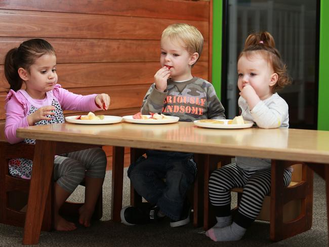 Isabelle Gilligan, 2, Justin Cowan, 3, and Mia Cains, 1, have allergies and enjoy afternoon tea together at Timber Tots Childcare Centre. Picture: Claudia Baxter