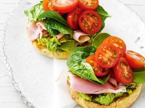 Spicy avocado toasted muffin with shaved ham and spinach.