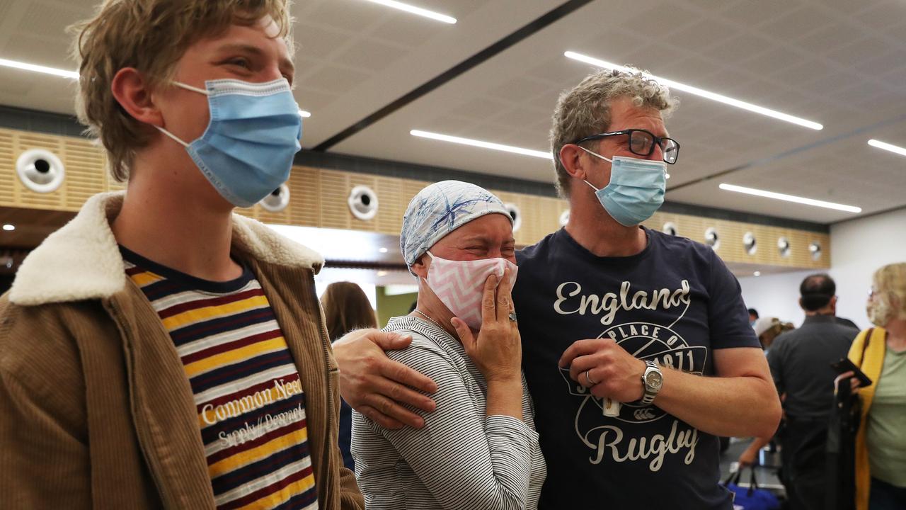 Kate Robertson who has been diagnosed with terminal cancer with son Noah and partner Nic Robertson waiting to meet her parents and two sisters who were arriving from the United Kingdom to see each other after 3 1/2 years. Picture: Nikki Davis-Jones