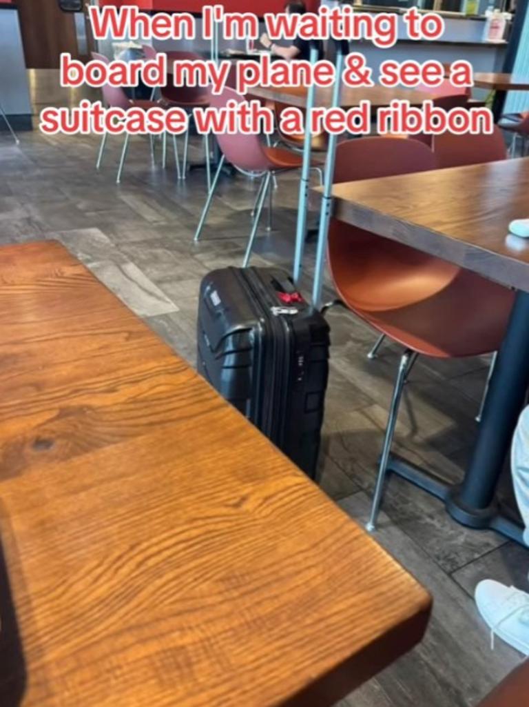 In the film, a suitcase with a red ribbon has a dangerous weapon inside. Picture: TikTok / @chinamereuzoeshi