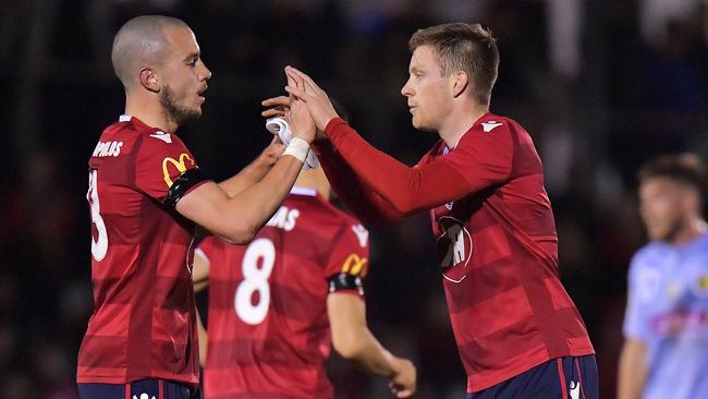 Mirko Boland of United and Ryan Kitto celebrate a goal during the round of 32 FFA Cup victory against Central Coast Mariners. Picture: Daniel Kalisz/Getty Images