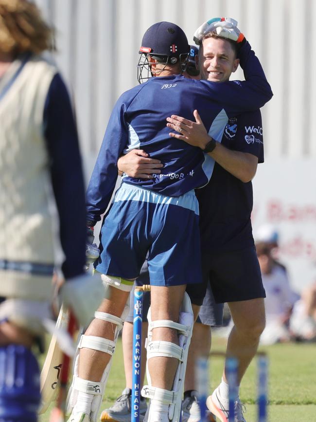 Mark Howard and Joel Selwood share a laugh and a hug. Picture: Mark Wilson