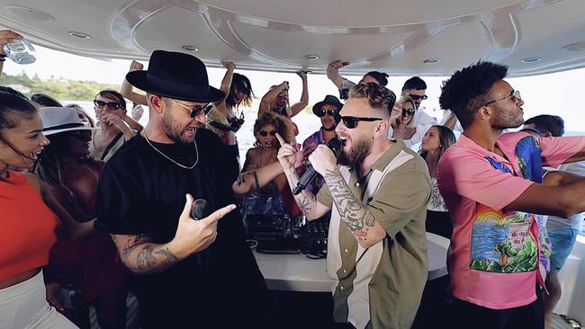 Singer and rapper Matthew Charles with DJ Emerson Alexander on board Sam Newman’s yacht.