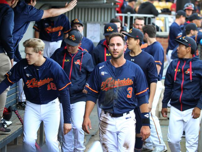 Adelaide Bite dugout for Saturday night's Australian Baseball League clash with Perth Heat. Players warming up on the field, sitting in the dugout during the game, in the bullpen and playing. 1 December 2018. (AAP Image/Dean Martin)