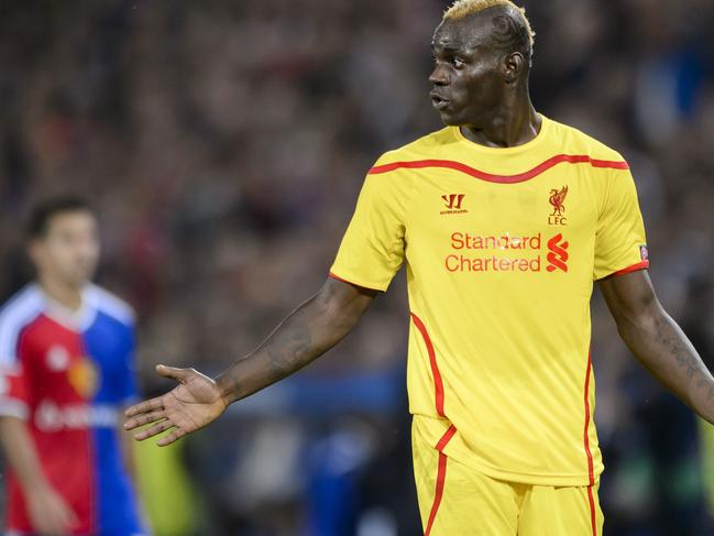 Liverpool's Italian forward Mario Balotelli reacts during the Champions League football match between FC Basel and FC Liverpool on October 1, 2014 at the St. Jakob-Park stadium in Basel. AFP PHOTO / FABRICE COFFRINI