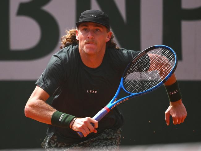 PARIS, FRANCE - MAY 27: Max Purcell of Australia runs for a shot against Henri Squire of Germany in the Men's Singles first round match on Day Two of the 2024 French Open at Roland Garros on May 27, 2024 in Paris, France. (Photo by Clive Mason/Getty Images)