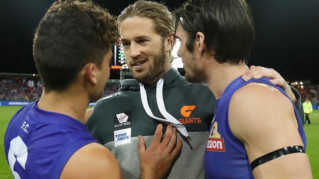 Callan Ward congratulates Luke Dahlhaus and Easton Wood.