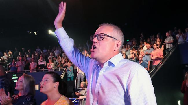 Scott Morrison and his wife, Jenny, take part in the Easter Sunday congregation at the Horizon Pentecostal church in Sydney’s Sutherland Shire. Picture: Gary Ramage