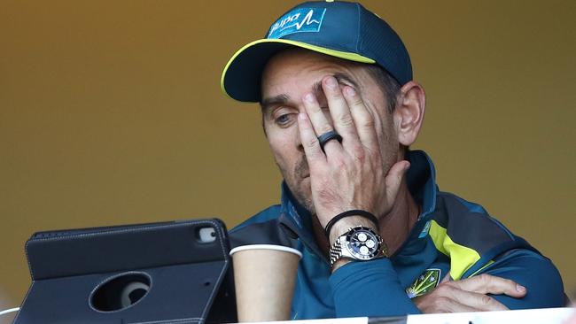 Justin Langer watches on as Australia’s batting collapses.