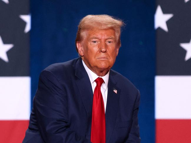 TOPSHOT - Former US President and Republican presidential candidate Donald Trump looks on during a town hall event at the Crown Complex in Fayetteville, North Carolina, on October 4, 2024. (Photo by Logan Cyrus / AFP)