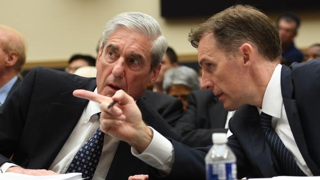 Former Deputy Special Counsel Aaron Zebley confers with Mueller. Picture: AFP