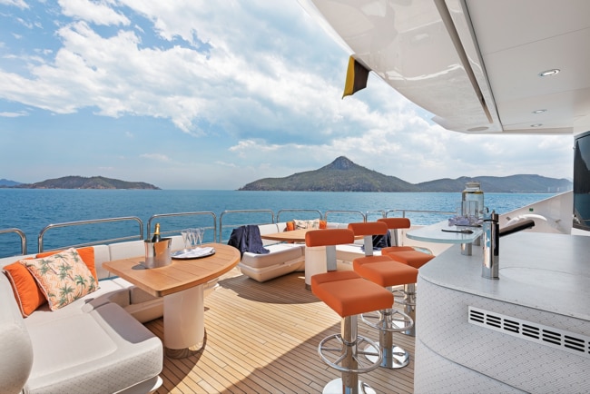 The sophisticated deck of Settlement, an Ocean Alliance boat, whose flybridge includes a bar area, ample seating and a jacuzzi. Picture: Tourism Australia