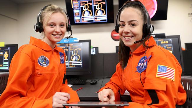                         <s1>Hamilton Secondary College students Alana Sievers, 17, and Chelsea Long, 19, take charge of a Mars mission from school’s space centre. </s1>Picture: Dean Martin