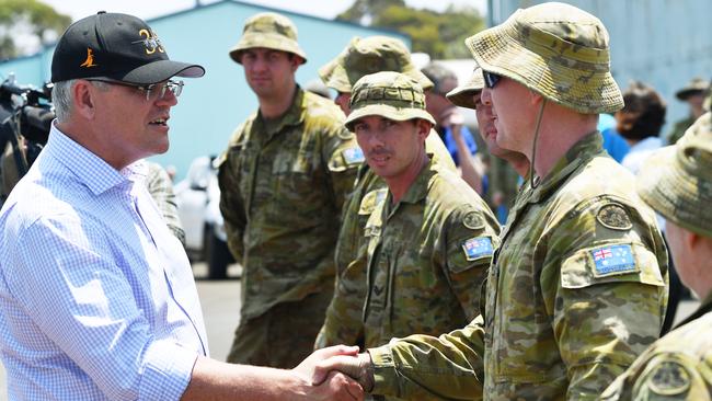 Scott Morrison greets troops during a visit to an army water purification station at Kingscote Jetty on Kangaroo Island earlier this month. Picture: AAP