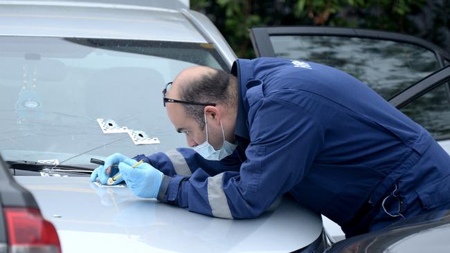 Police at the scene where officers shot a person in an alleged stolen car in a McDonalds carpark in Tullamarine on February 7. Picture: Andrew Henshaw