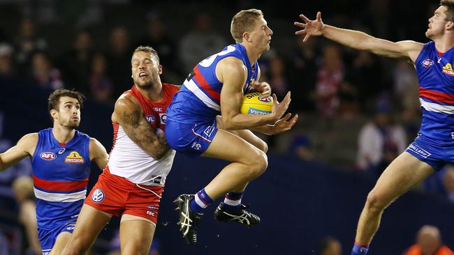 Aaron Naughton takes an intercept mark in front of Lance Franklin. Picture: Michael Klein