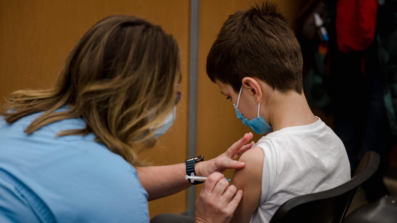 A child, 11, receives the Pfizer-BioNTech Covid-19 vaccine for children in Montreal, Canada. TGA approval has now been granted in Australia to administer a reduced dose to children aged five to 11, with the rollout expected to begin 10 January, 2022. Picture: AFP